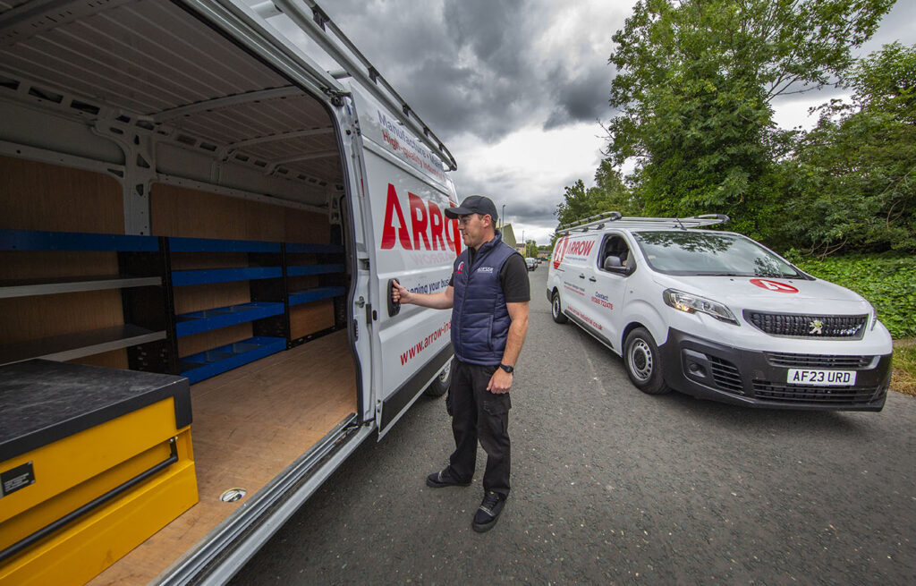 An Arrow Industrial Engineer on a fire door repair visit